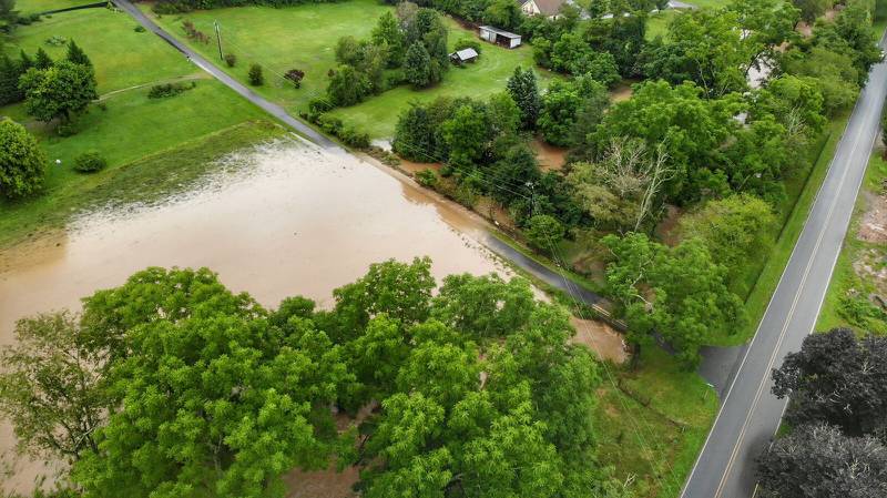 AUGUST 18, 2021 - Pigeon River, bridge washed out and road underwater in the Beaverdam Community in Canton. (Photo credit: Suzie Pressley)