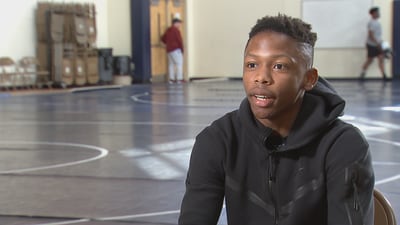 Local high school wrestler overcomes odds to make history
