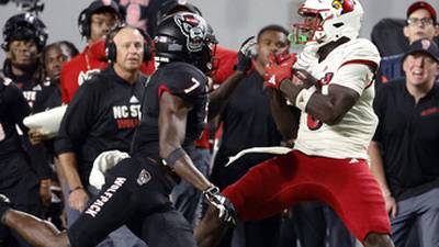 PHOTOS: Louisville uses defense to stay unbeaten, top N.C. State 13-10 with late field goal