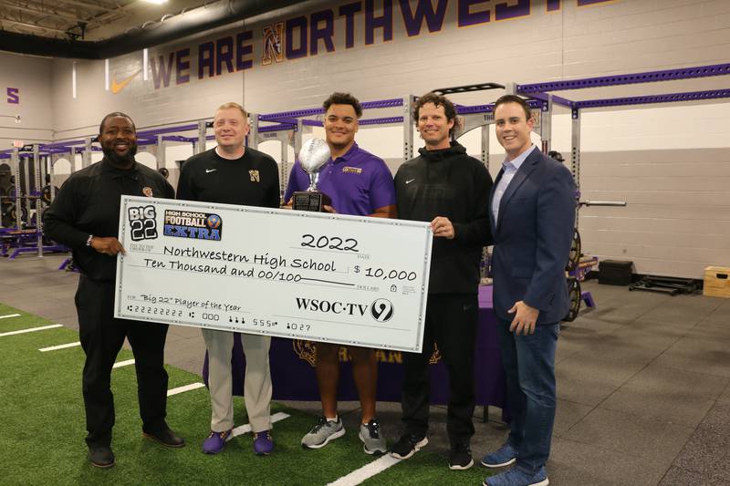 Channel 9 Sports Director Phil Orban presented Jordan Knox of Northwestern High School with the 2022 Big 22 Player of the Year trophy. The high school also received a check for $10,000. Nov. 18, 2022.