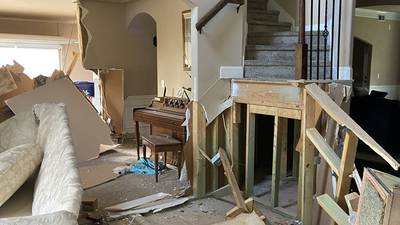 PHOTOS: Car drives completely through Huntersville home, displacing owner