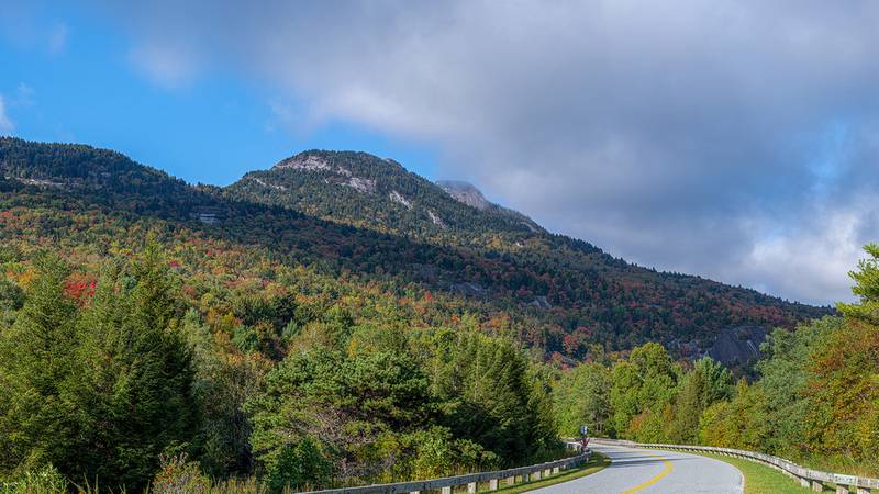Oct. 2, 2023: Hints of fall color are appearing in the North Carolina High Country, especially at higher elevations, as seen here in this photo of Grandfather Mountain taken from the Blue Ridge Parkway. The area has experienced many sunny days and cool nights the last few weeks, prompting the seasonal transition. While some pockets of color and certain trees are very vibrant at the moment, the overall landscape is still mostly green. The weather forecast for the week looks pleasant for those wanting to get the first glimpses of fall.