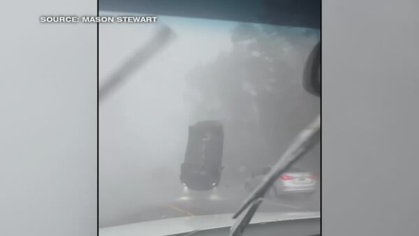Woman describes surviving tornado after wind flips her car near Charleston