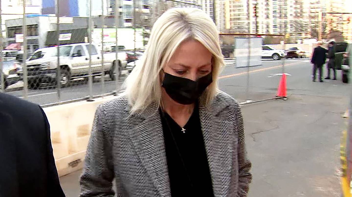 Donna Steele enters the federal courthouse in Charlotte to plead guilty to wire fraud on Wednesday, Jan. 12, 2022.