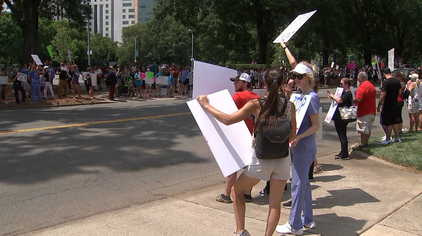 Hundreds of people gathered at Freedom Park in Charlotte to make their voices heard against Atrium and Novant Health’s COVID-19 vaccine mandate for employees.