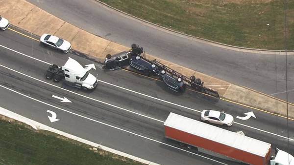 Car carrier flips onto median at ramp to I-85 in north Charlotte