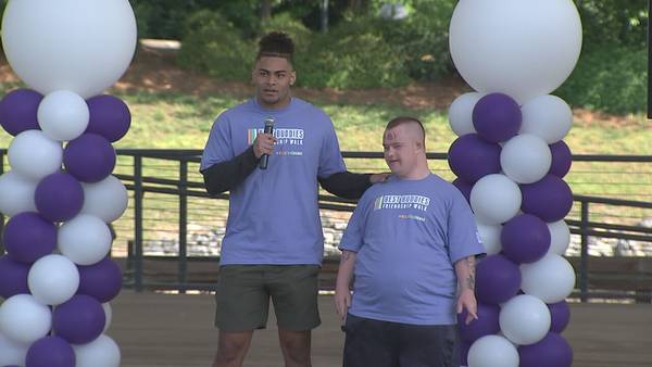 Panthers tight end joins lifelong friend who lives with Down syndrome for ‘Best Buddies’ walk