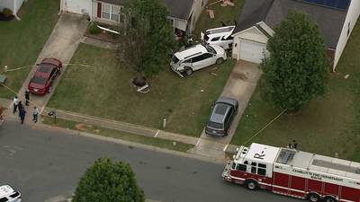 PHOTOS: Police investigating shooting where cars crashed into home in west Charlotte