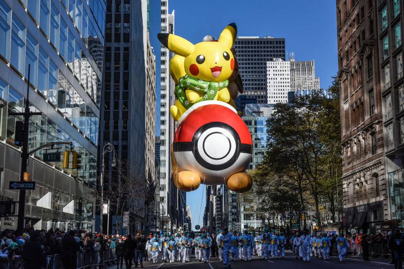 NEW YORK, NEW YORK - NOVEMBER 23: The Pikachu balloon floats in Macy's annual Thanksgiving Day Parade on November 23, 2023 in New York City. Thousands of people lined the streets to watch the 25 balloons and hundreds of performers march in this parade happening since 1924. (Photo by Stephanie Keith/Getty Images)