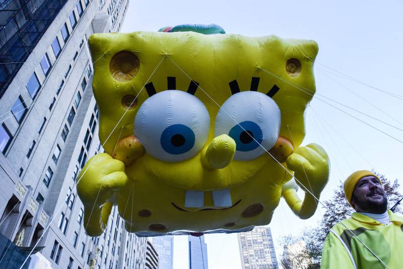 NEW YORK, NEW YORK - NOVEMBER 23: The SpongeBob Squarepants balloon floats in Macy's annual Thanksgiving Day Parade on November 23, 2023 in New York City. Thousands of people lined the streets to watch the 25 balloons and hundreds of performers march in this parade happening since 1924. (Photo by Stephanie Keith/Getty Images)