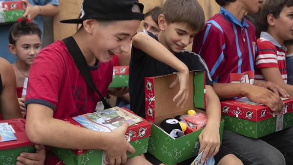 Volunteers prepare 2.4 million Christmas gift boxes for kids around the world