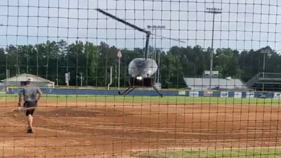 Helicopter helps dry field for high school softball team’s playoff game