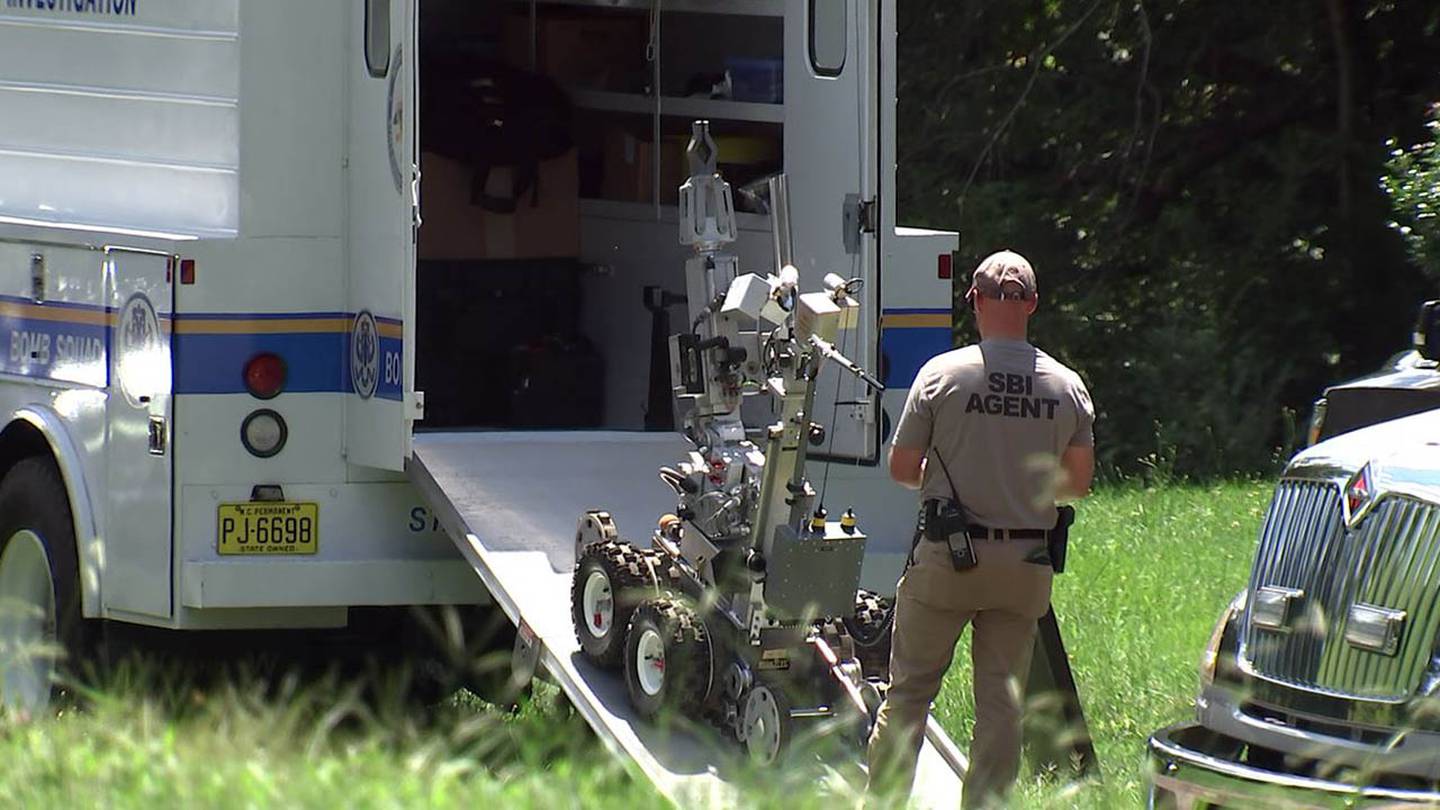 SBI agents use a robot to check for explosives at the Cleveland County home of Ray Roseberry on Thursday, Aug. 19, 2021. Roseberry claimed to have a bomb in a pickup truck near the Capitol in Washington D.C.