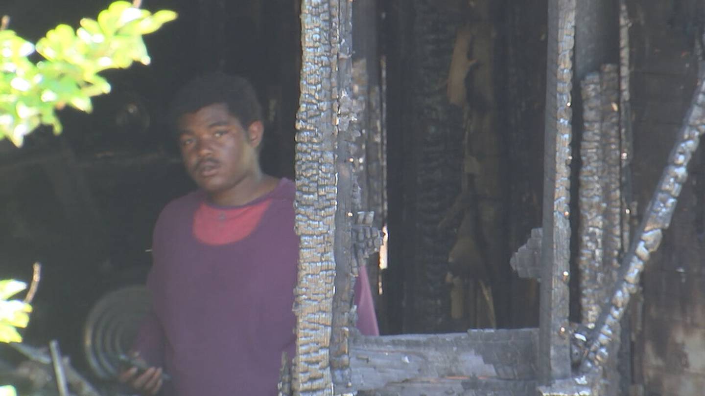 Hakeem Stansford stands in the home that burned down earlier this week in Lincolnton
