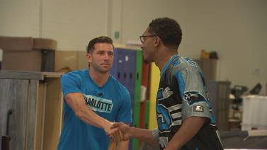 Charlotte FC, Panthers players help build furniture for families in need