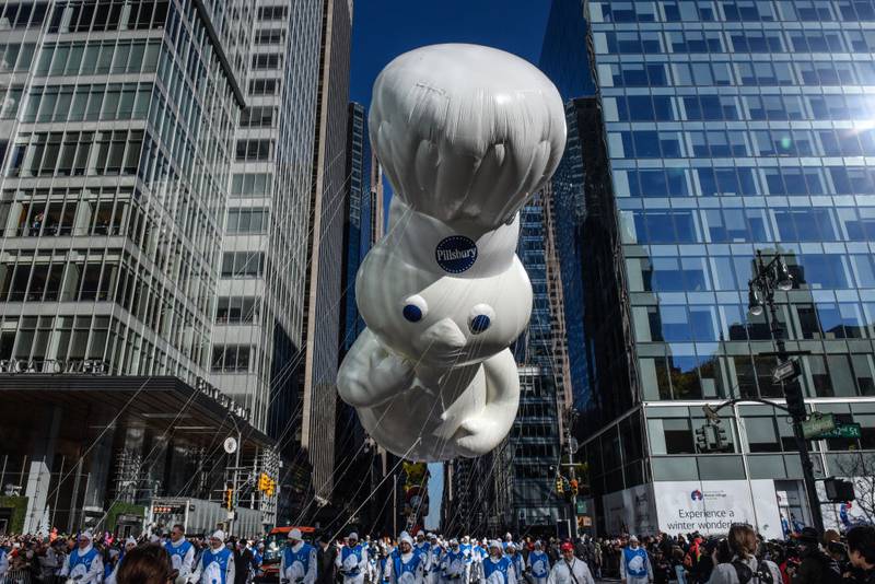 NEW YORK, NEW YORK - NOVEMBER 23: The Pilsbury balloon floats in Macy's annual Thanksgiving Day Parade on November 23, 2023 in New York City. Thousands of people lined the streets to watch the 25 balloons and hundreds of performers march in this parade happening since 1924. (Photo by Stephanie Keith/Getty Images)