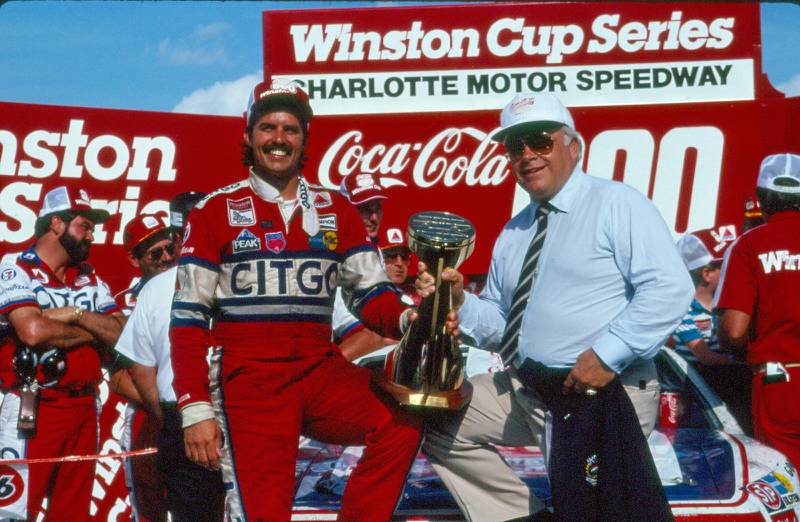 Kyle Petty (left) and CMS owner Bruton Smith at the Coca-Cola 600 (1987).