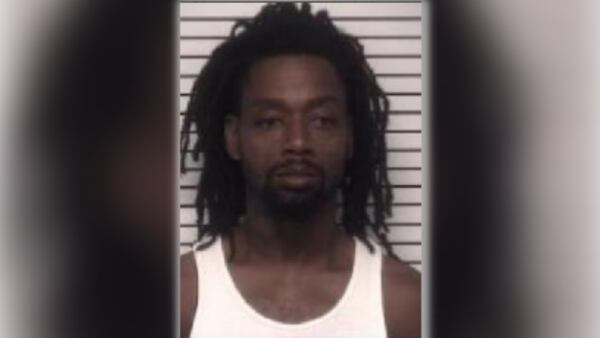 Suspect arrested after man found dead outside of a car in Statesville, police say