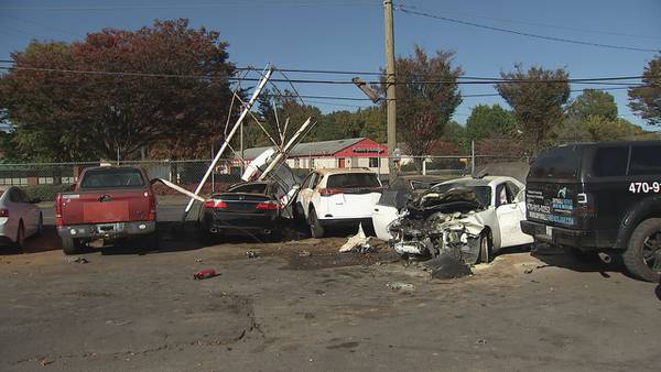 ‘Everything is damaged’: Multi-county chase’s fiery crash heavily damages local dealership 