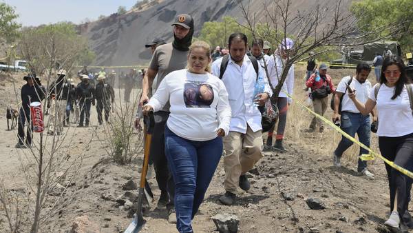 Searchers find a charred pit on Mexico City's outskirts that may be a clandestine crematorium