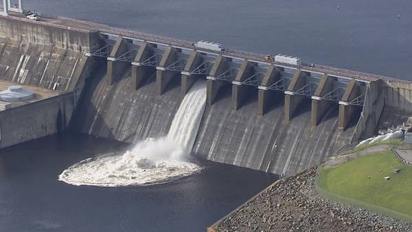 Residents monitor river levels after floodgates to dam open