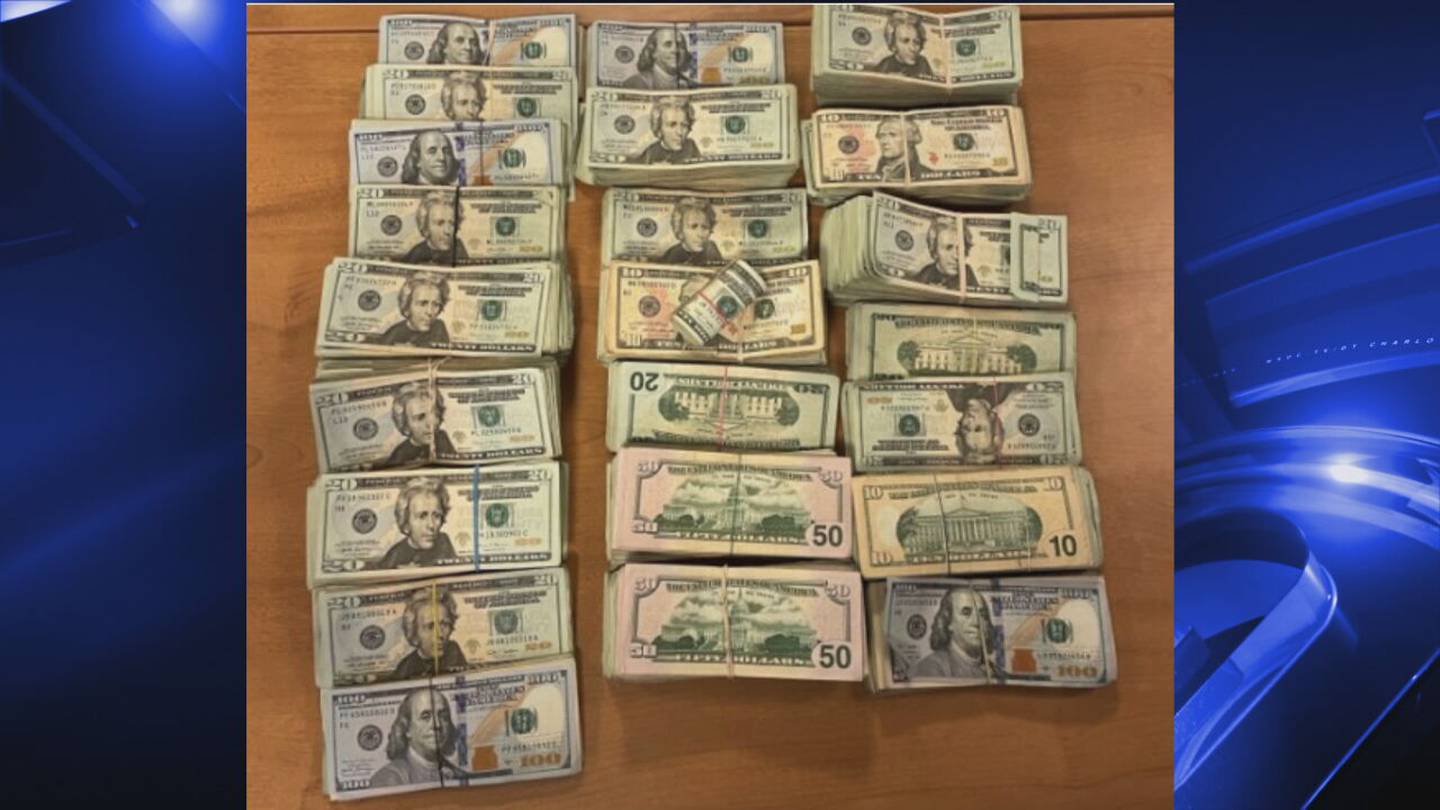 Stacks of money found inside passenger's suitcase at CLT