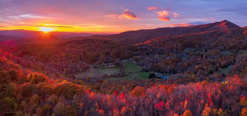 Before the morning clouds moved in, today’s sunrise bathed the landscape in warm, orange hues, enhancing the area’s already vibrant fall colors, as seen from nearby Banner Elk.
