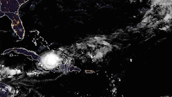 Tropical Storm Oscar dumps heavy rain on eastern Cuba as it heads toward the Bahamas