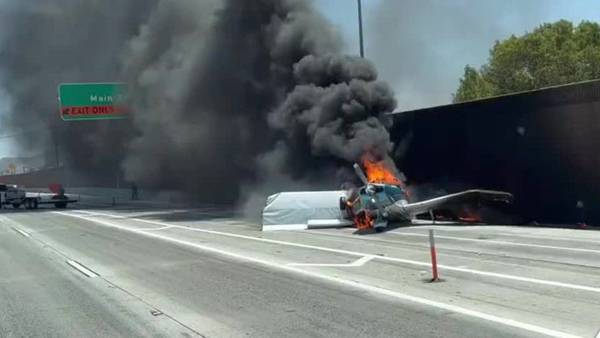 Small plane makes emergency landing on California freeway, catches fire