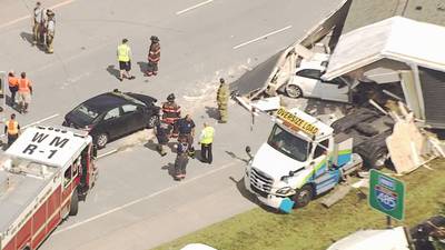 Photos: Tractor-trailer carrying mobile home crashes on I-485