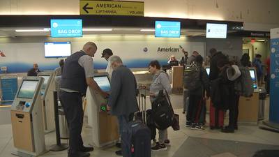 American Airlines flight attendants fight for better pay as busy travel week rolls in 