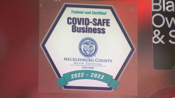 What does it mean if you see a COVID-SAFE sticker at a Meck County business?