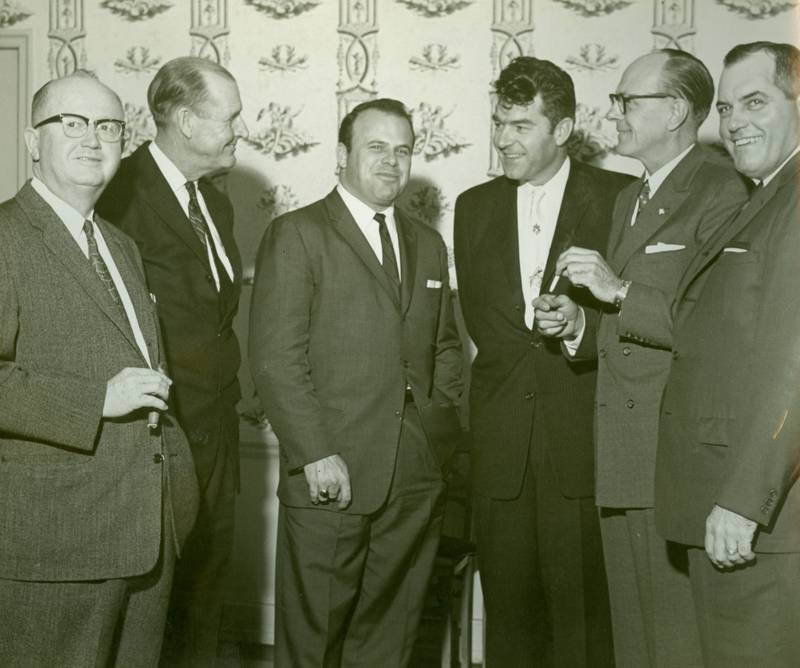 Bruton Smith (3rd from left) and Curtis Turner (3rd from right) with 4 of the 5 original board of directors. Early 1960s.