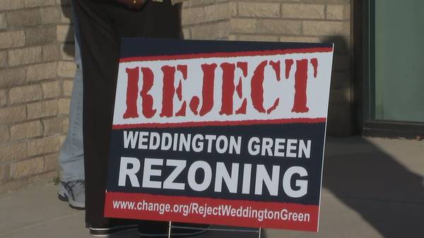 Residents accuse town workers of taking signs opposing Weddington Green project from their yards