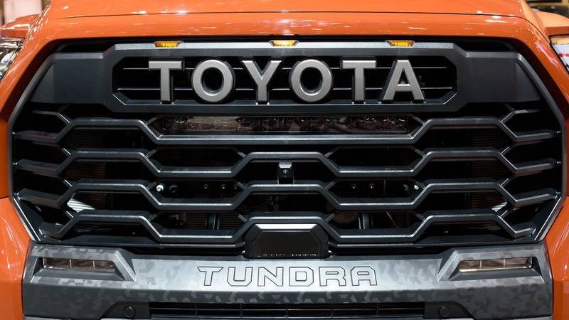 The word Toyota in the grille of a Tundra vehicle or car