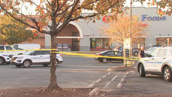 One shot in east Charlotte grocery store parking lot