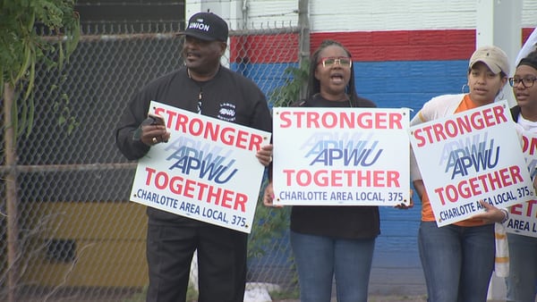 USPS employee’s union protests over layoff fears and changes within agency
