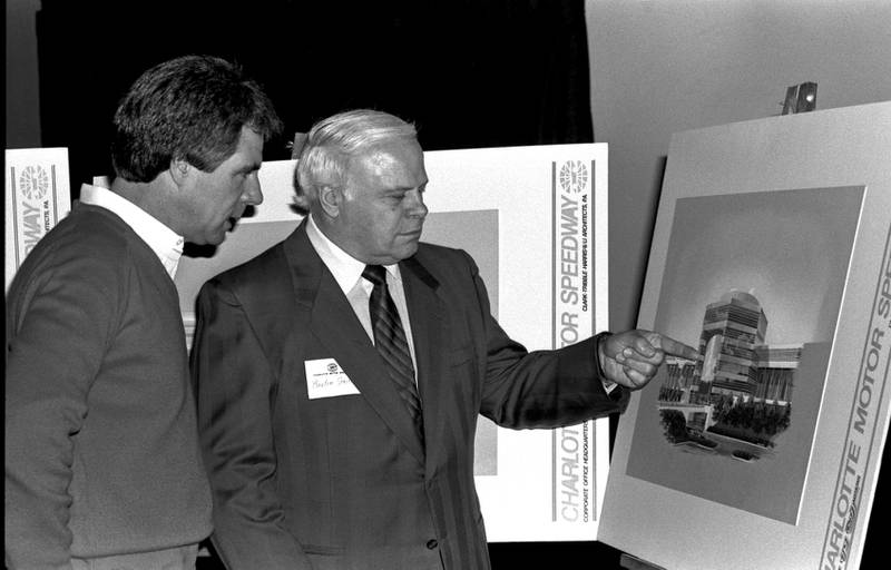Bruton Smith (right) explains the Smith Tower to Darrell Waltrip (December 1985).