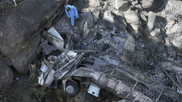 Investigators search for bodies of Easter pilgrims in bus that crashed off a bridge in South Africa