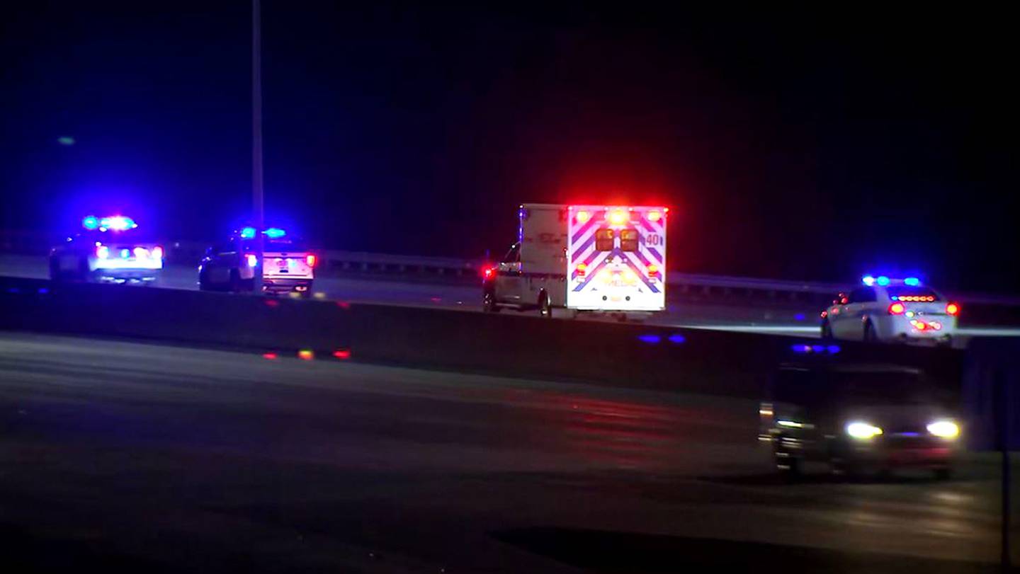 An apparent police procession escorts an ambulance to the hospital from the crash scene along I-85 in northeast Charlotte on Wednesday Dec. 22, 2021.