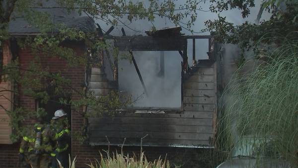 Neighbor pulls woman out of burning home to safety