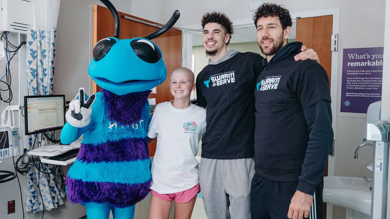 Charlotte Hornets players LaMelo Ball and Vasilije Micic along with Hugo the Hornet visited Novant Health Hemby Children’s Hospital on April 8, 2024. The group went room-to-room delivering and autographing Hugo children’s books and visiting with patients and their families.