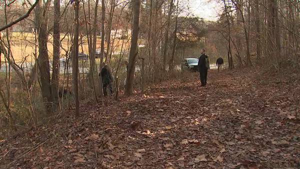 Arrests made after body found in wooded area in Catawba County