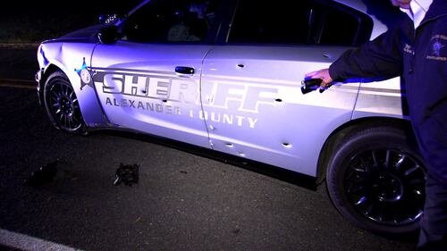 Dozens of police officers and deputies responded after a deputy was hit and injured by a stolen patrol car in Alexander County on Friday, Dec. 17, 2021.