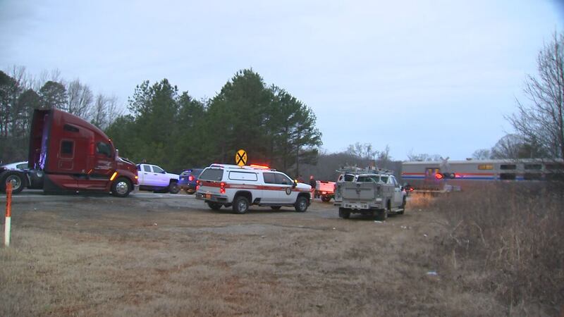 An Amtrak train was stopped in Gaston County early Tuesday morning after hitting a tractor-trailer.