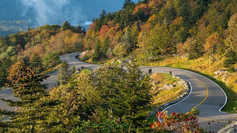 Oct. 9, 2023: The park road at Grandfather Mountain provides a nice snapshot of the current landscape. While some vibrant trees and pockets of color dot the hillsides, there is still much to come. Overall in the region, a lot of green remains. This view from the switchbacks near the top of the mountain shows the entrance of the Bridge Trail across from the Black Rock parking lot.