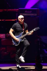 Joe Satriani performs during the Best of All Worlds Tour at PNC Music Pavilion on July 19, 2024.