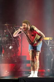 Rapper Post Malone performs during his “If Y'all Weren't Here, I'd Be Crying Tour" at PNC Music Pavilion in Charlotte on July 29, 2023.