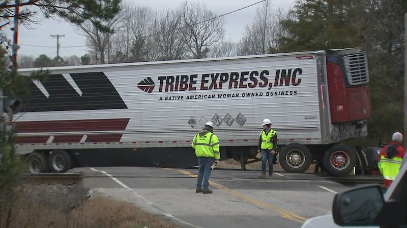 An Amtrak train was stopped in Gaston County early Tuesday morning after hitting a tractor-trailer.