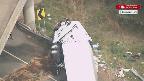 Chopper 9 Skyzoom shows debris and leftover fuel spill after crash on ramp from I-485 to I-77.